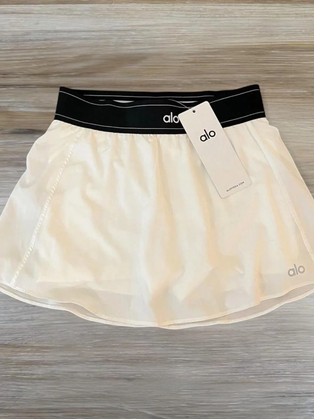 Alo Women's White Tennis Skirt with Black Waistband